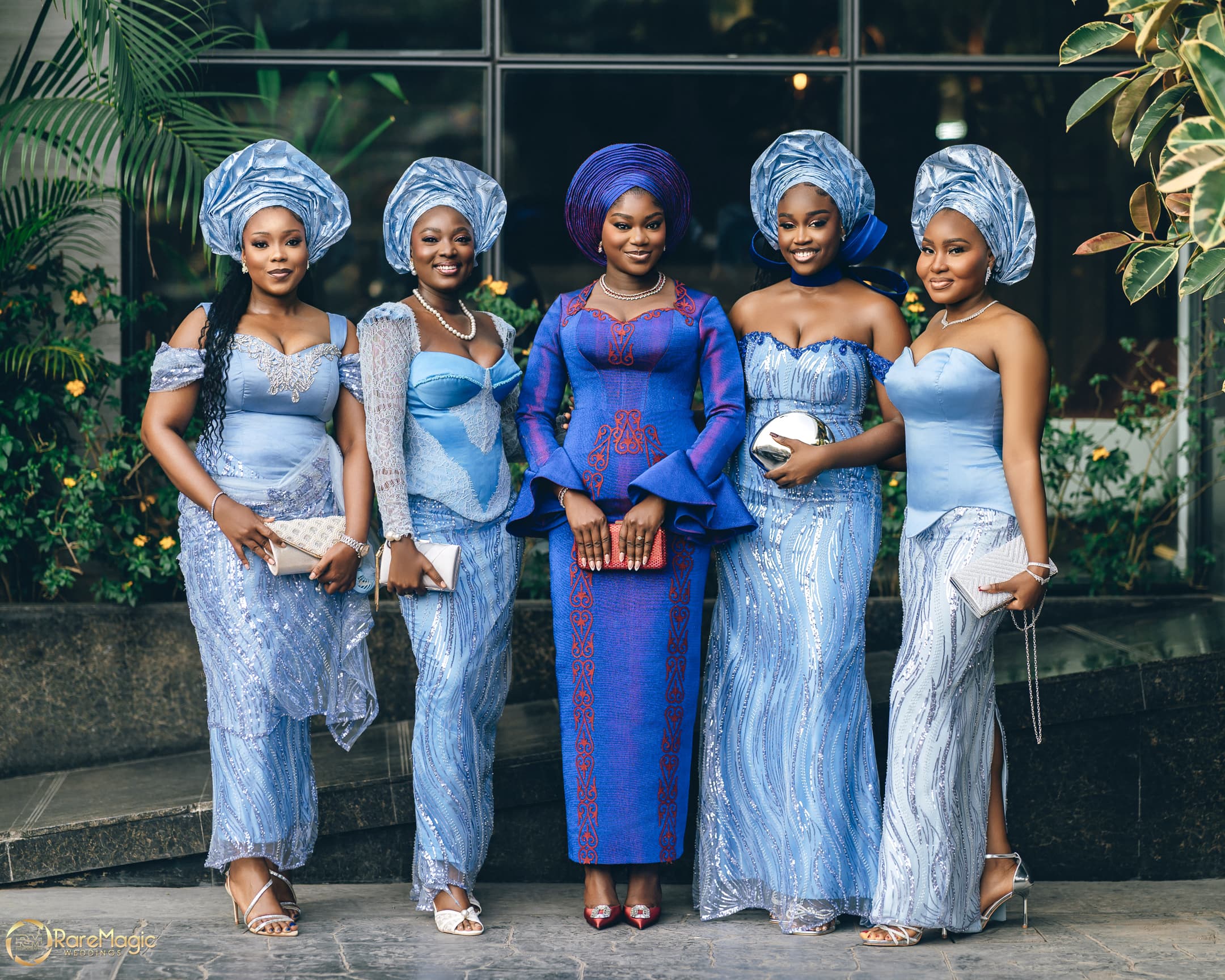 Elegant women in matching blue aso-ebi at a Crimson Events celebration